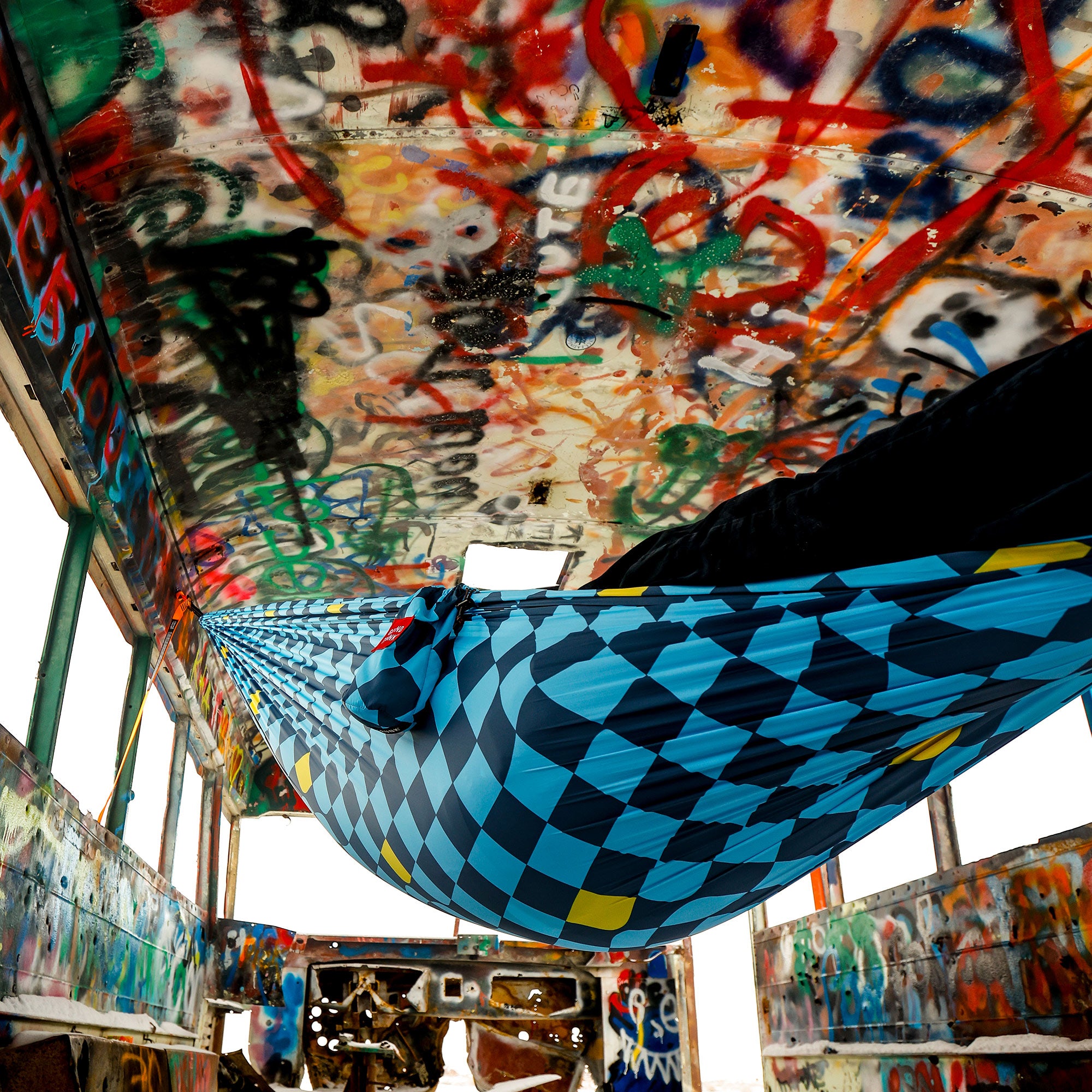 Flowcheck print TrunkTech™ Hammock in a graffiti bus