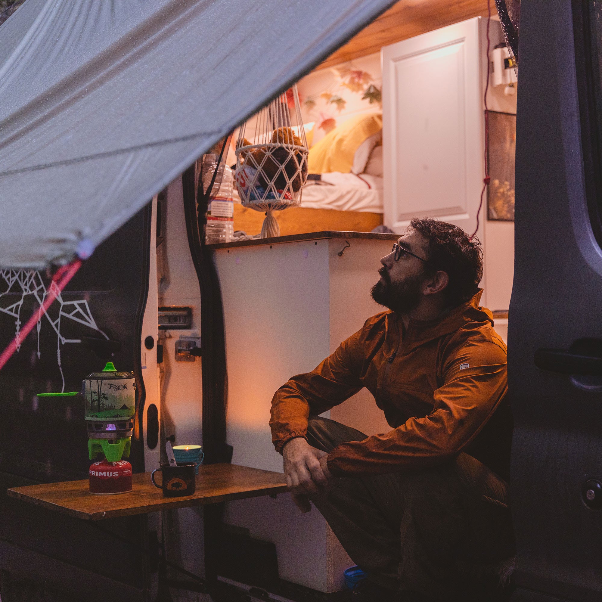 moab set up as a lean-to shelter with a van, basically an additional awning for any vehicle