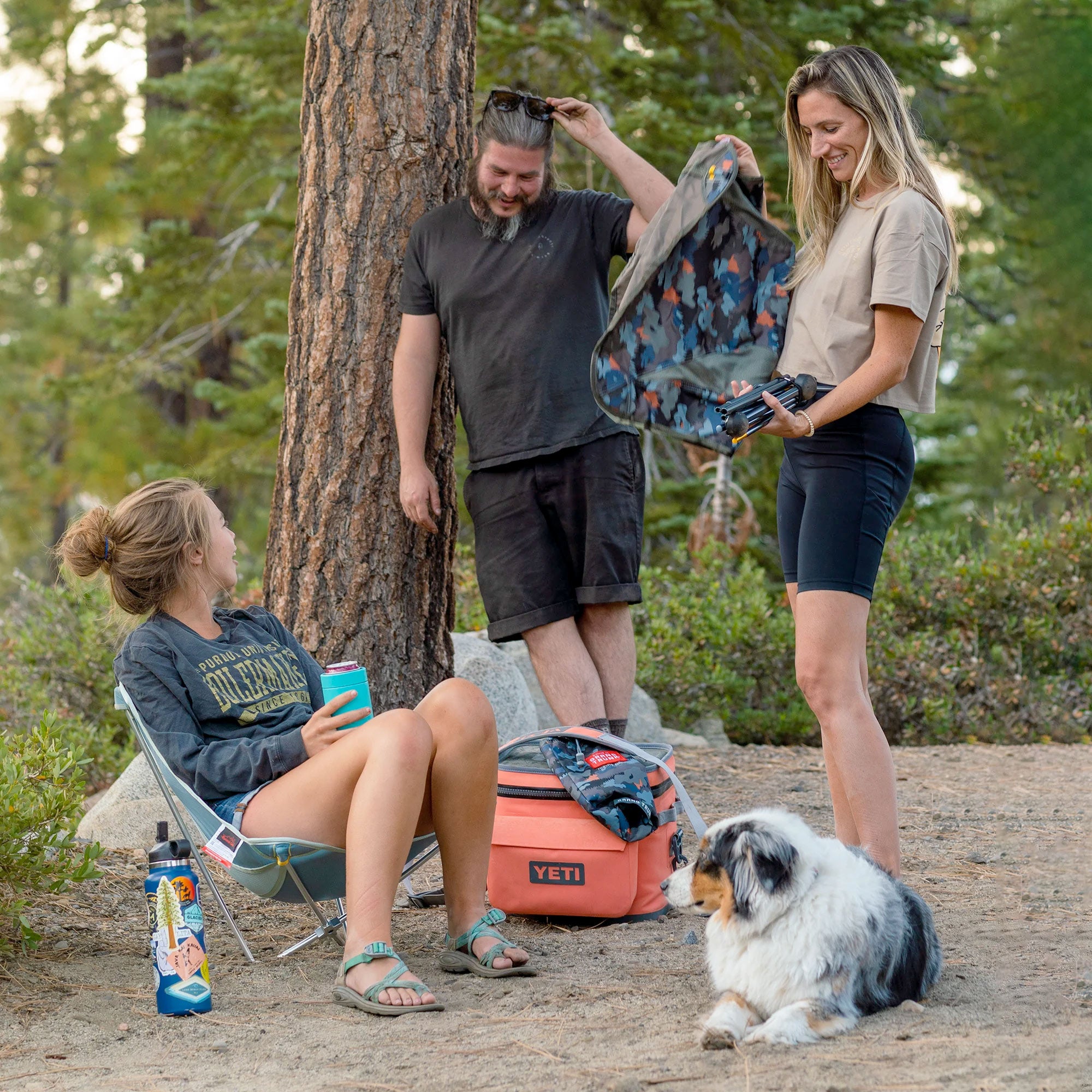 Group hanging out with Grand Trunk Monarch Chair and dog leaning back