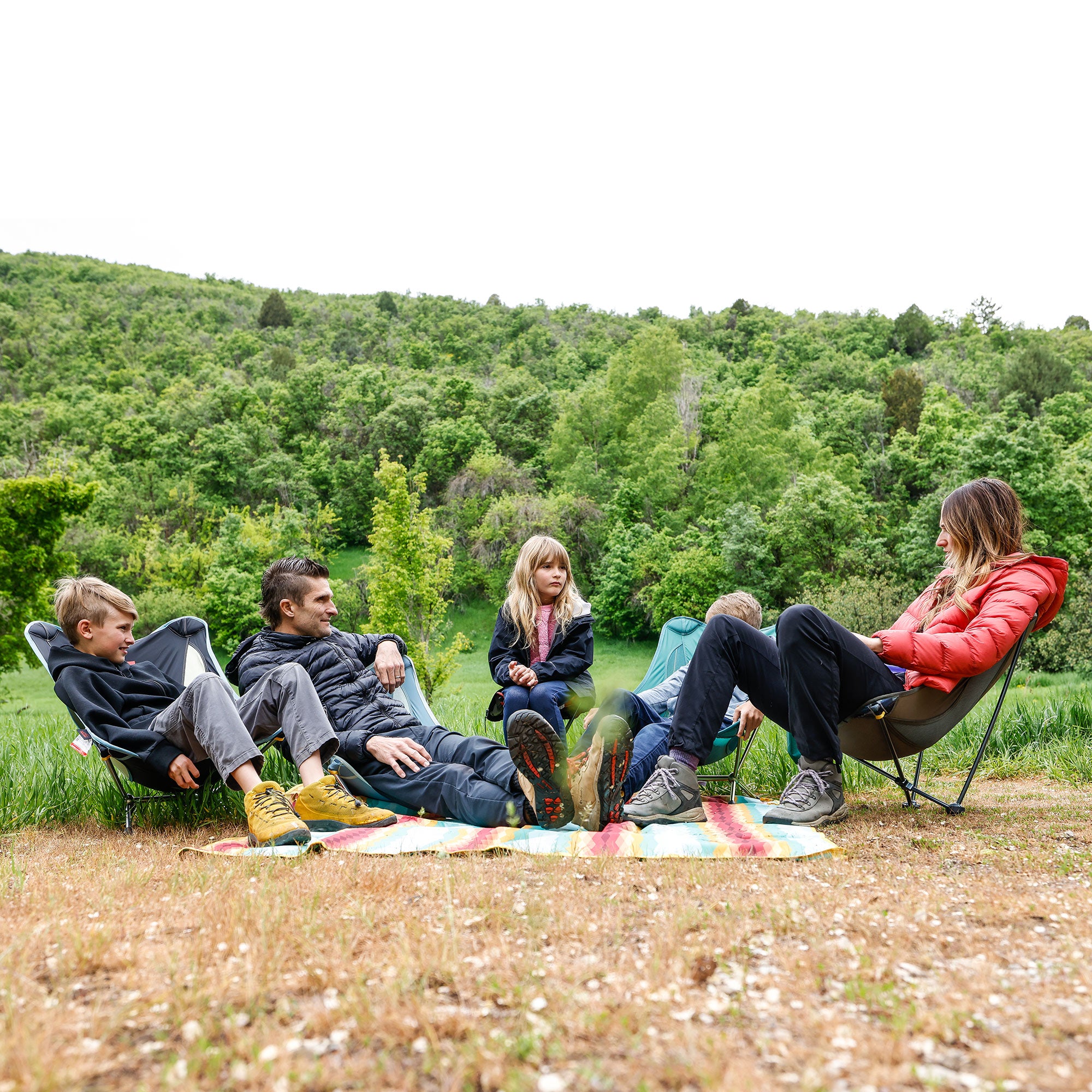 Family sitting in monarch, mantis, mayfly chairs rockable leaning chairs rocking and compass 360 swivel stool
