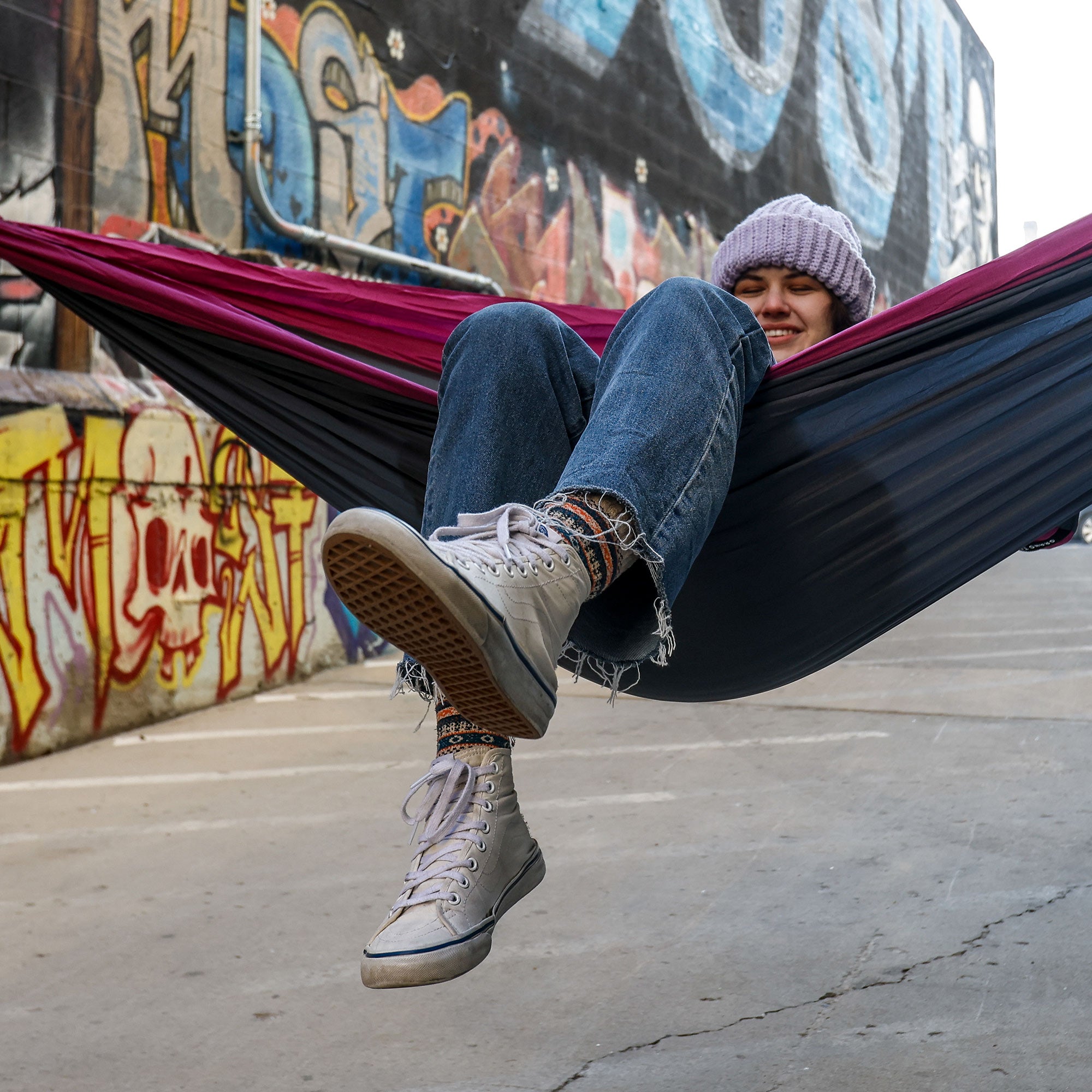 gray magenta purple hammock urban hammocking adventure girl with beanie cold weather adventure
