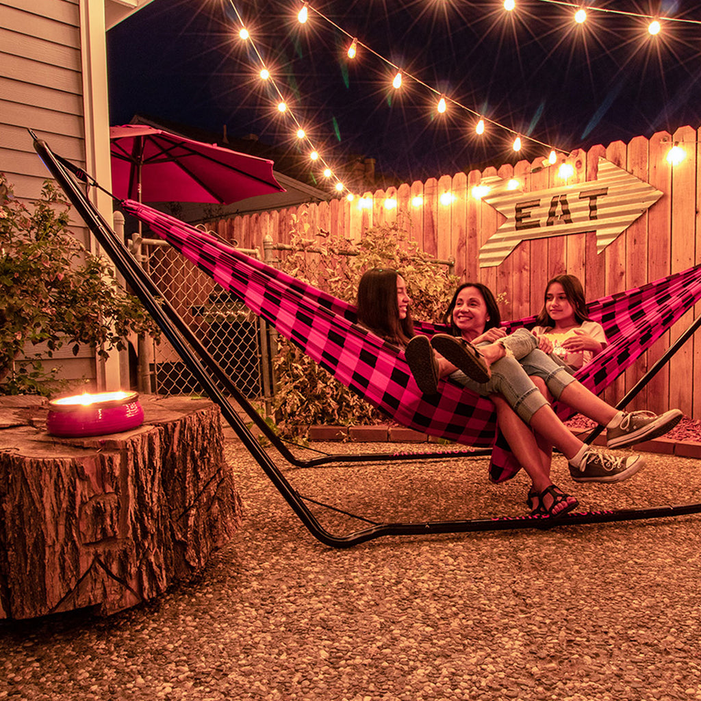 3 ladies enjoy the Grand Trunk Hammock Stand