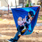 Mother and childern in ROVR hanging chair swinging and laughing