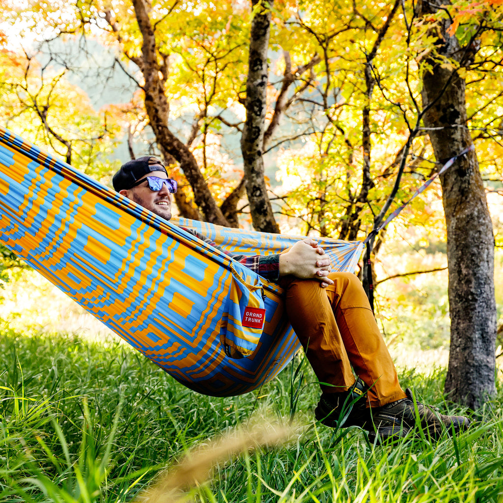 switchback print TrunkTech™ hammock man sitting in forest enjoying the fall foliage view
