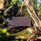 air bivvy all weather shelter set up in forest keeps bugs out while hammock camping
