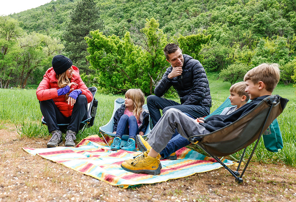 Family enjoying time outdoors in Grand Trunk chairs