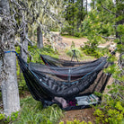 mozzy 360 bug net shelter set up with evolution hammock inside and gear on the floor all protected from bugs or mosquitos