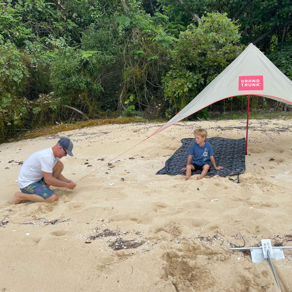 setting up the shadecaster 2 on a deserted island beach