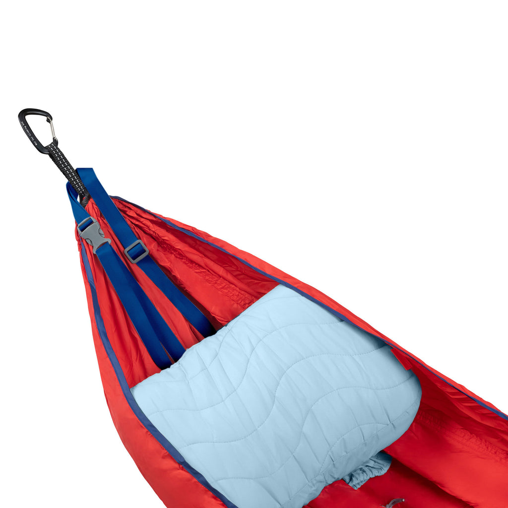 studio photo of the siesta hammock pillow inside of a hammock